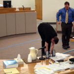 Kenneth Nalan and Eric Hedland measure and map out the bedroom.