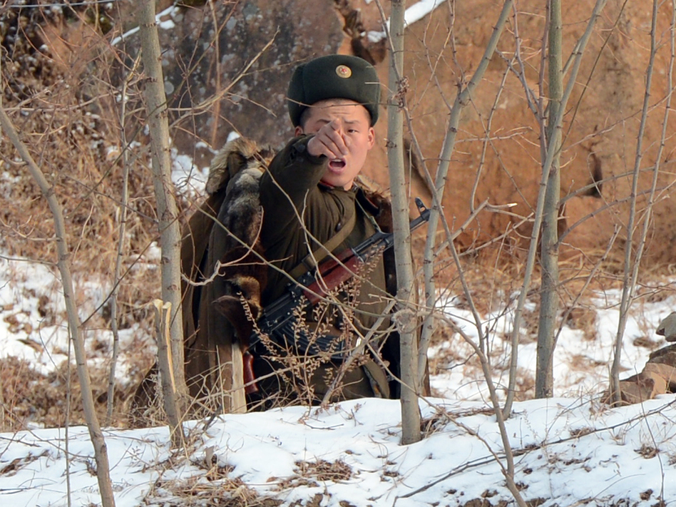 Image 161510286-d7252e17475b9d715f9551e77a3594ccf3db8a64-s6.jpg A North Korean soldier reacts as he patrols along the Yalu River near the Chinese border last month. Mark Ralston/AFP/Getty Images