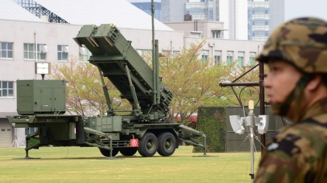 Japan is on full alert ahead of an expected mid-range missile launch by North Korea, its defense minister said as the U.N. warned of a potentially 'uncontrollable' situation. A Japanese soldier walks past a missile launcher deployed in Tokyo. Toru Yamanaka/AFP/Getty Images