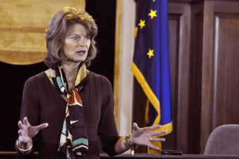 Sen. Lisa Murkowski talks with reporters during a press availability following her annual address to the legislature, Feb. 19 2014. (Photo by Skip Gray/Gavel Alaska)