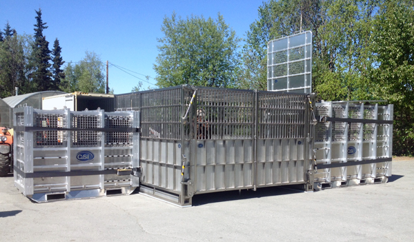 The polar bear holding module, is flanked by two transportation crates. (Photo by Josh Edge, APRN – Anchorage)