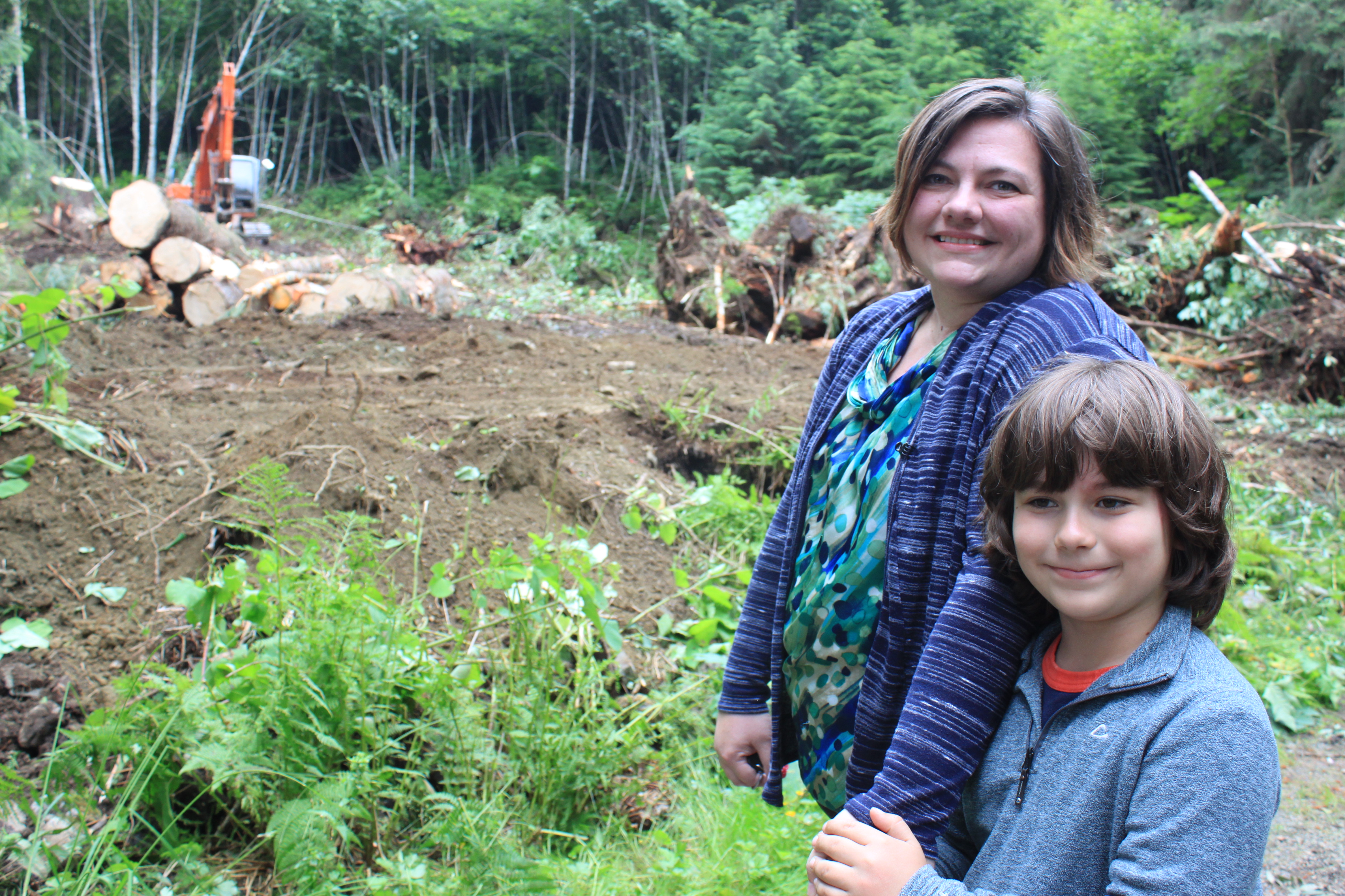 AWARE's Mandy Cole brought her son Theron, 8, to the groundbreaking. (Photo by Lisa Phu/KTOO)