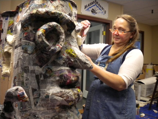 SueAnn Randall puts together a puppet at the Merchant's Wharf on Saturday, Jan. 24. (Photo Courtesy of Kevin Reagan)