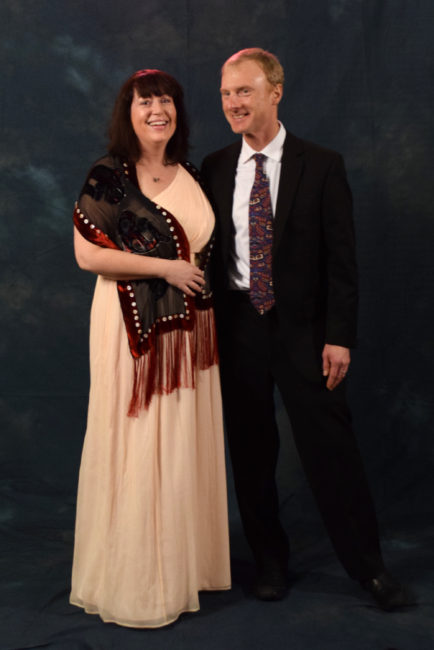 Kate Buley and Jerry Post.  Buley is wearing a J. Crew dress and a scarf made by local artist Cory Mann. (Photo by Skip Gray/KTOO)