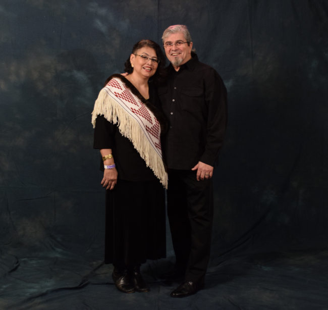 Gail Cheney and James Franco.  Cheney said her Ravenstail sash woven in a flying geese pattern and lined with sea otter fur was a mix of "style and culture."  (Photo by Skip Gray/KTOO)