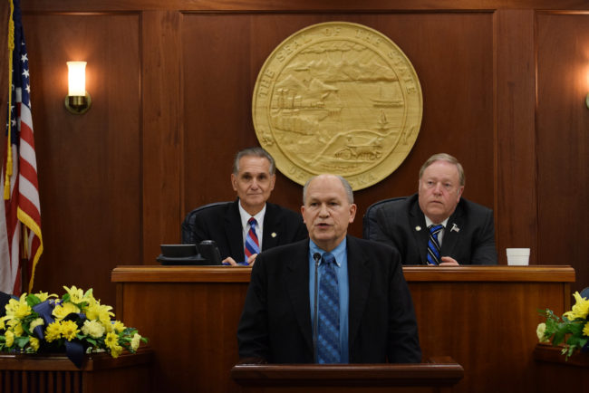 Alaska Gov. Bill Walker speaks in front of a joint session of the Alaska Legislature in a State of the Budget Address, Jan. 22, 2015. Senate President Kevin Meyer and House Speaker Mike Chenault are seated behind him. (Photo by Skip Gray/360 North)