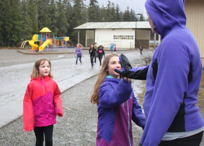 Girls on the Run meets twice a week. After discussing the day's lesson, they run laps around the school, working towards completing a 5K. (Photo by Lisa Phu/KTOO)