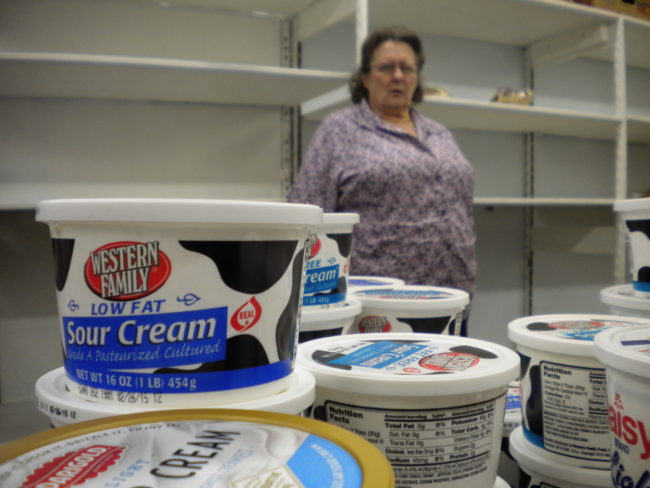 (Judy Brown volunteers every Saturday at the Southeast Alaska Food Bank. She says they quickly run out of meats and cheeses after opening at 8:30 a.m. (Photo by Kevin Reagan/ KTOO)