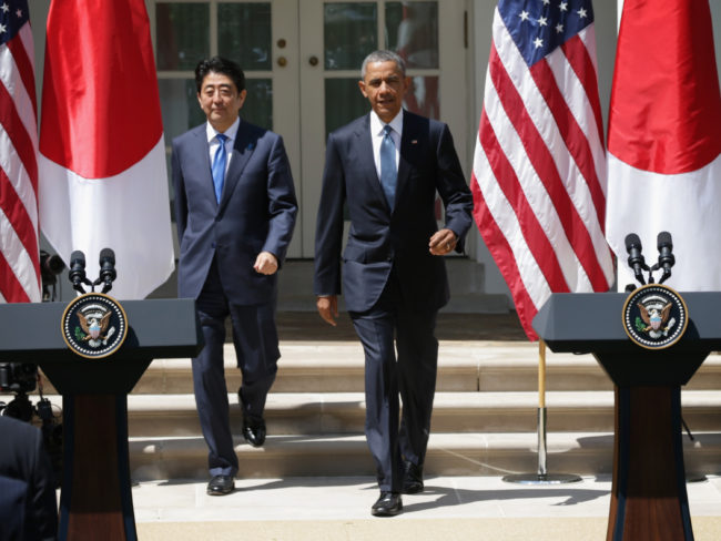 President Obama and Japanese Prime Minister Shinzo Abe approach the podiums for a joint press conference Tuesday at the Rose Garden of the White House in Washington. President Obama is hoping to finalize a new trade agreement with Japan and other Asian nations soon. (Photo by Alex Wong/Getty Images)