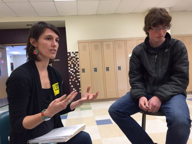 Regan Brooks teaches about storytelling as Service High student Kevin Goodman listens. (Photo by Anne Hillman/KSKA)