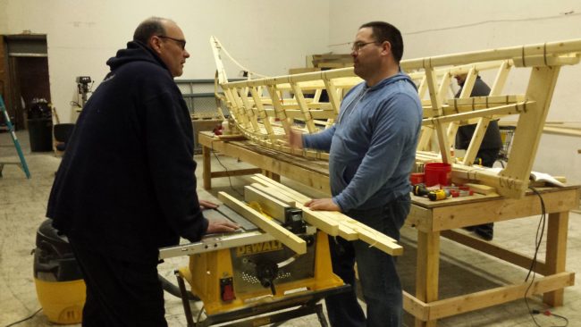 CJ Christiansen (right) and Mitch Keplinger discuss what to do next on boat. (Photo by Kayla Desroches, KMXT – Kodiak)