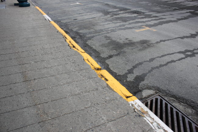 These sidewalks were originally designed to look like wood planks. (Photo by Lisa Phu/KTOO) 