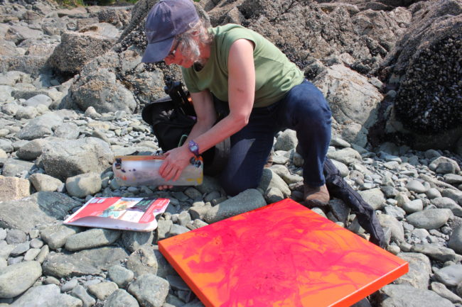 As the tide comes in, Baltuck gathers her art supplies. (Photo by Lisa Phu/KTOO)