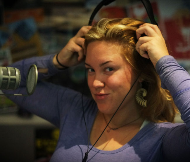 Giselle Stone in the KXLL studio. (Photo by Annie Bartholomew/KTOO)