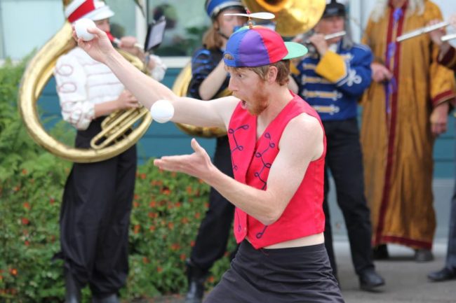 A New Old Time Chautauqua performer juggling in the streets of Wrangell, June 26, 2015. (Photo by Zachary "Skip" Waddell/New Old Time Chautauqua)