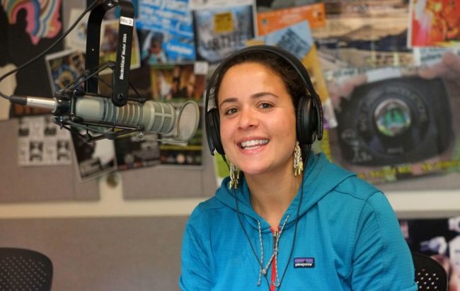 A photo of Jill Weitz with headphones on