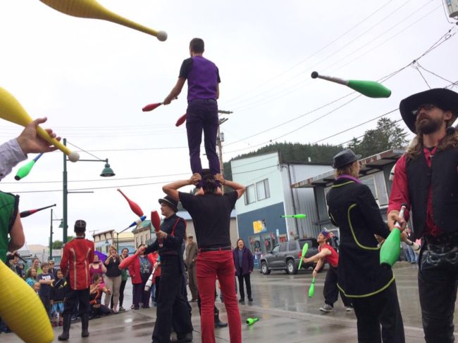 New Old Time Chautauqua jugglers in a rainy teaser show in Wrangell on June 26, 2015. (Photo by Zachary "Skip" Waddell/New Old Time Chautauqua)