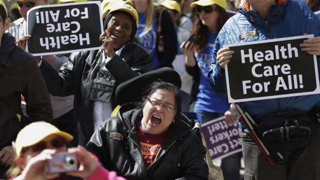 Protesters march on the Texas Capitol to try to persuade legislators to expand Medicaid under the Affordable Care Act. The state’s decision not to expand has denied Medicaid coverage to 1.7 million Texans. (AP)