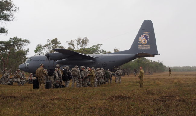 Members of the 4/25th Airborne Brigade of JBER load up on a C-130 during exercise Talisman-Saber. (Photo by Zachariah Hughes/KSKA)