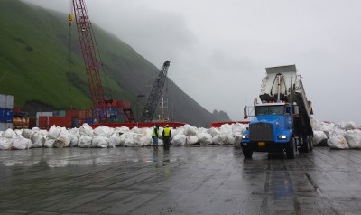 The marine-debris barge loads bagged tsunami trash in Kodiak July 16. (Photo by Kayla Desroches/KMXT)