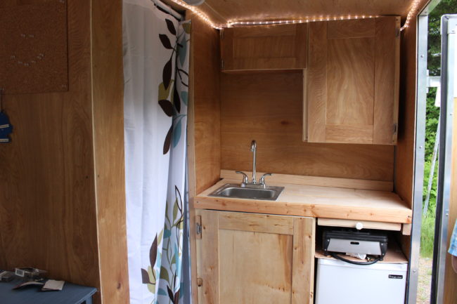 The small bathroom is separated from the kitchen by a curtain. (Photo by Elizabeth Jenkins/KTOO) 
