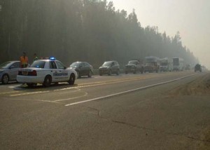 Troopers stop traffic on the Parks Highway Monday morning as the Sockeye Fire spreads. (Photo by John Norris/ Alaska Public Media)