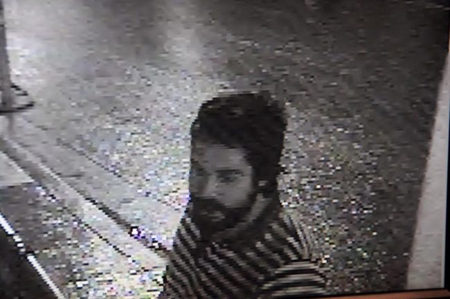 A video still of one of the three men that Capitol building security suspects scaled the Capitol to steal rooftop flags. 
