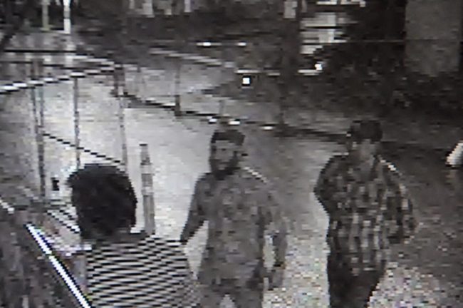 A video still of the three men that Capitol building security suspects scaled the Capitol to steal rooftop flags.  