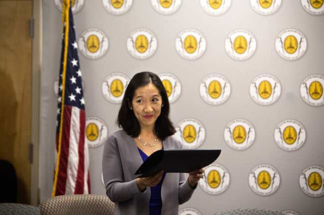 Leana Wen hands out awards to business owners for their efforts to support breastfeeding at the Baltimore City Health Department on Tuesday. Meredith Rizzo/NPR