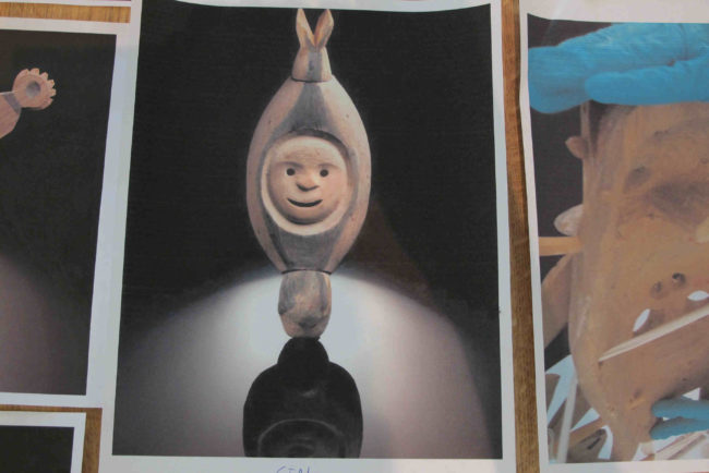 A team from the Vatican brought images of masks to Alaska as they attempt to trace the history of the masks. (Photo by Ben Matheson / KYUK)