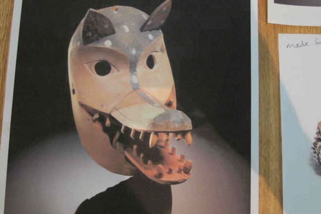 The team brought images of the masks that were given to the Pope in 1924. (Photo by Ben Matheson / KYUK)