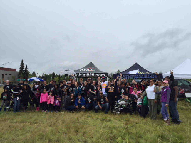 The attendees of the Stop the Violence rally pose for a photo. (Photo by Anne Hillman/KSKA)