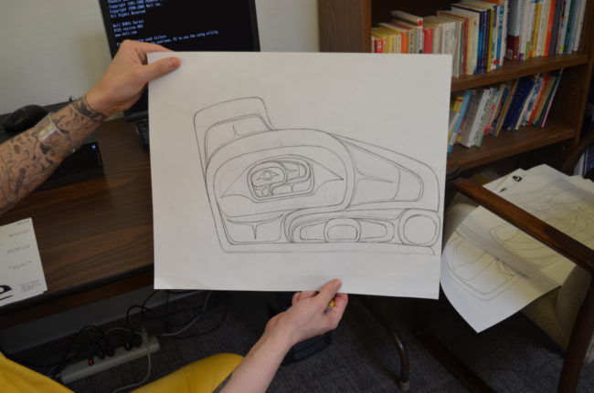 William Littlefield holds his drawing. He hopes to make and teach art professionally when he is released. (Photo by Scott Burton/KTOO)