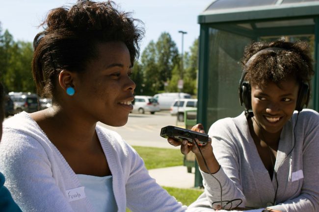 Olive Mtoni records Furaha Sefania outside of UAA. (Photo courtesy of ATMI.)