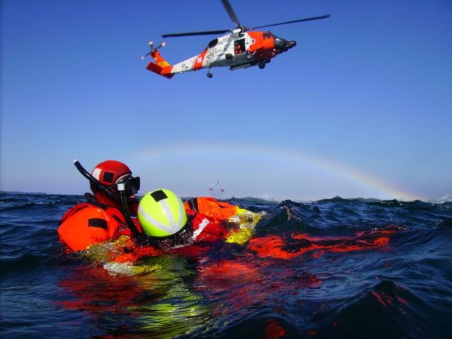 Rescue swimmers from Coast Guard Air Station Kodiak wait for a basket pickup by an MH-60 Jayhawk helicopter during open water training off the coast of Kodiak Island April 23, 2008. (Official USCG photo by PA1 Kurt Fredrickson)