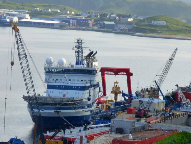The Fennica and its yellow capping stack in Alaska's Dutch Harbor on July 18. (Photo by John Ryan/KUCB)