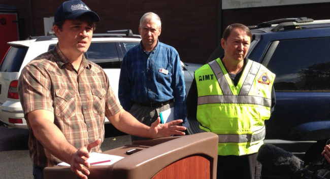 Jeremy Zidek, spokesman for Homeland Security, briefs the media Thursday morning in Sitka. National Weather Service incident meteorologist Joel Curtis (center), and incident commander Al Stevens (right), were preparing for more rain on Friday. (KCAW photo)
