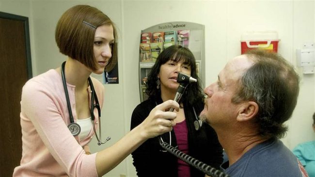 A University of Arizona medical student examines a patient at the Copper Queen Community Hospital in Bisbee, Arizona. Copper Queen has allied with other rural hospitals in southern Arizona to survive. (AP)