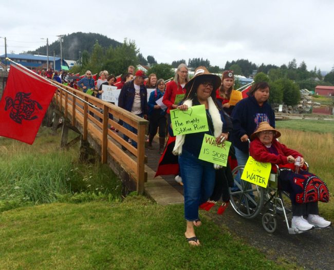 Tribal member Apryl Hutchinson arrives at Shakes Island at the end of the march. (Photo by Katarina Sostaric/KTSK)