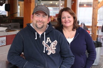 David McGivney and Tracy LaBarge sit outside their other establishment, Tracy's King Crab Shack. (Photo by Elizabeth Jenkins/KTOO) 