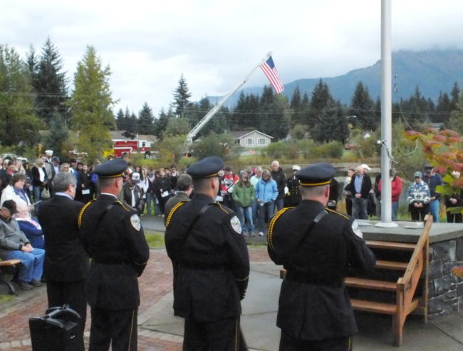 A silent moment of the prayer before the raising of the American flag at Riverside Rotary Park. (Photo by Matt Miller/KTOO)