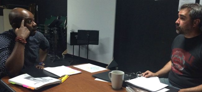 Jamil Mangan who plays Othello (left) and director Tom Robinault talk about the play. (Photo courtesy of Tom Robinault)