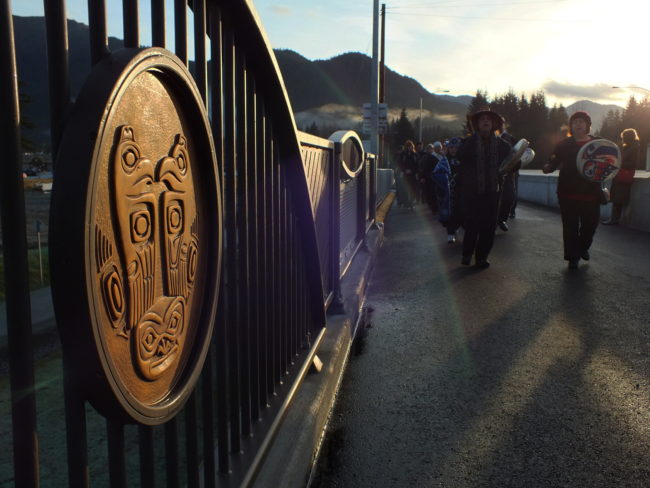 Procession of builders and local Native leaders make their way across the bridge. (Photo by Matt Miller/KTOO)