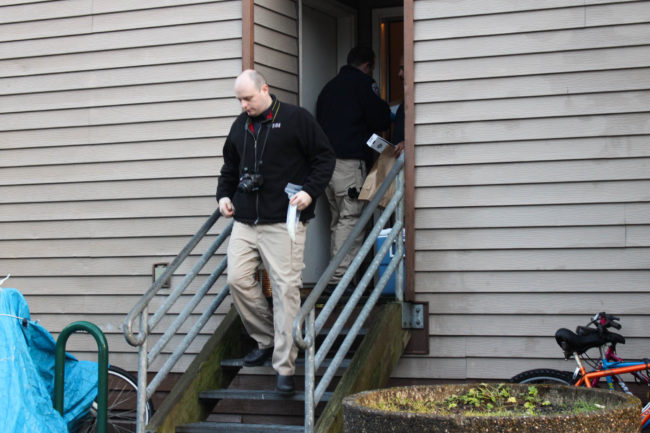 Juneau police investigate the scene of the alleged murder on Douglas Island Thursday morning. (Photo by Elizabeth Jenkins/KTOO)