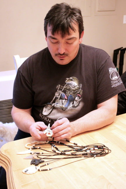 Rob Kenney still has a lot of his brother's ivory carvings. (Photo by Lisa Phu/KTOO)
