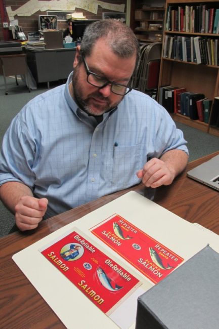 Ross Coen with canned salmon labels