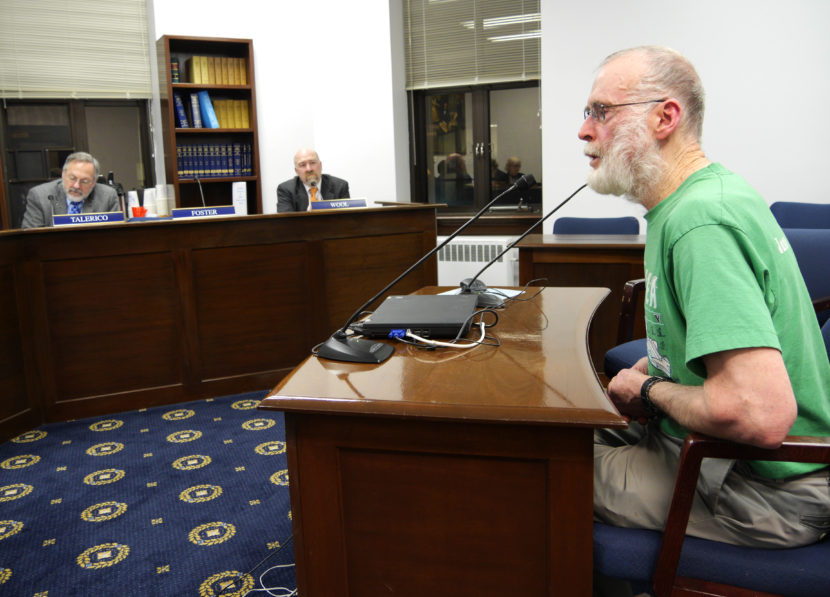 Juneau resident Gary Miller, whose daughter died from a heroin overdose, testifies before the Alaska House Health and Social Services Committee, January 26, 2016. He was showing his support for Senate Bill 23 which would provide immunity for prescribing, providing, or administering opioid overdose drugs. (Photo by Skip Gray/360 North)