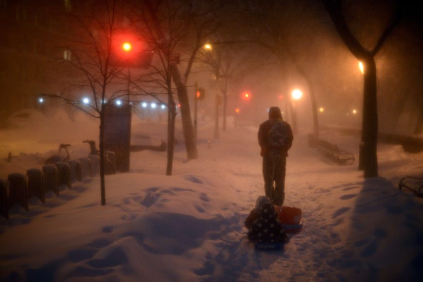 Children are pulled home after playing in the snow in New York City, on Jan. 23. Astrid Riecken/Stringer/Getty Images