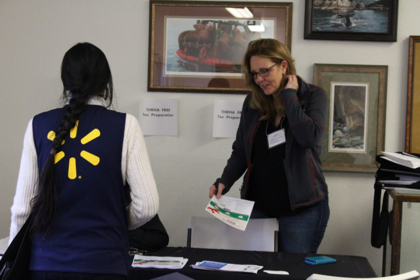 A Wal-Mart employee talks speaks to Tlingit-Haida Regional Housing Authority. (Photo by Elizabeth Jenkins/KTOO)