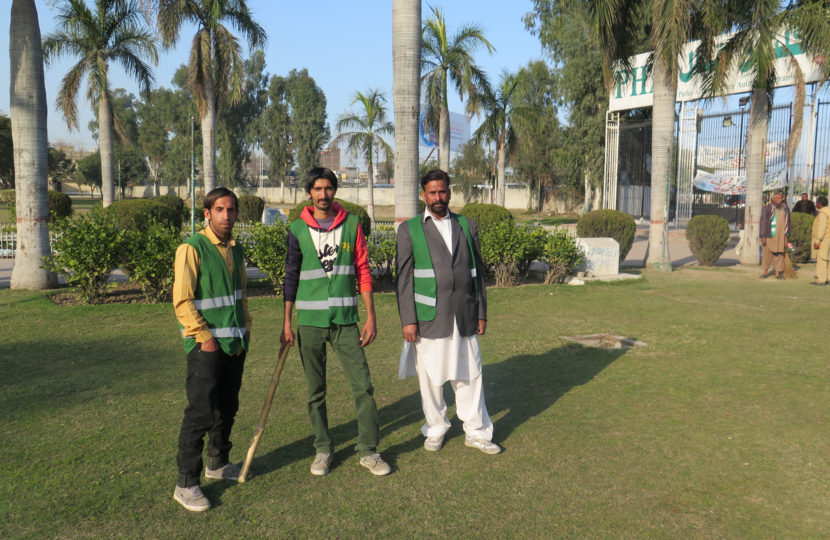 These guards patrol a park in the Pakistani city of Gujranwala to make sure there's no sexual harassment of women. If they have to, they'll deliver a sharp tap to an offender with that stick. From left: Mohammed Sayed, Mohammed Faisal and Amir Hussein. Philip Reeves/NPR